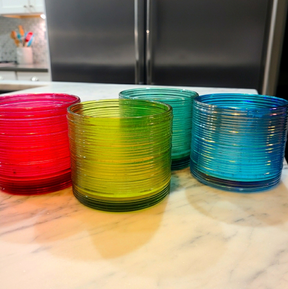 Four glass containers for candle making